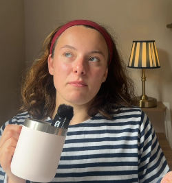 Grace at home with a mug