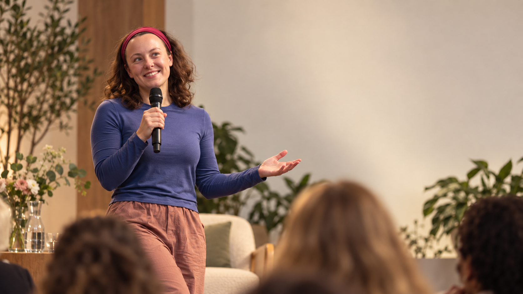 Grace speaking at a live event